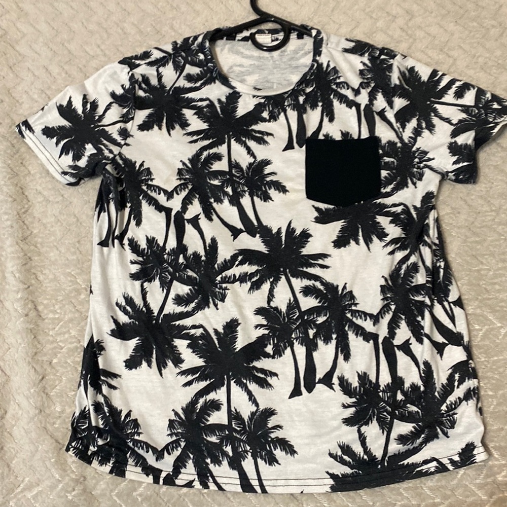 Selling a beach shirt with black palm trees and size,12-14 boys